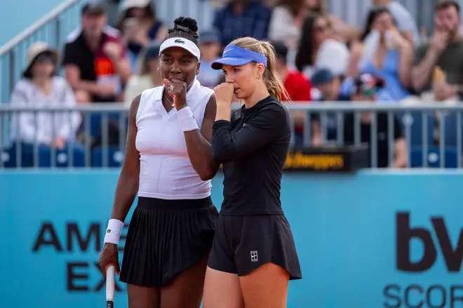 Katie Boulter of Great Britain and Venus Williams of United States are seen talking against Xinyu Jiang of China and Yifan Xu of China in the Women's Doubles Round of 32