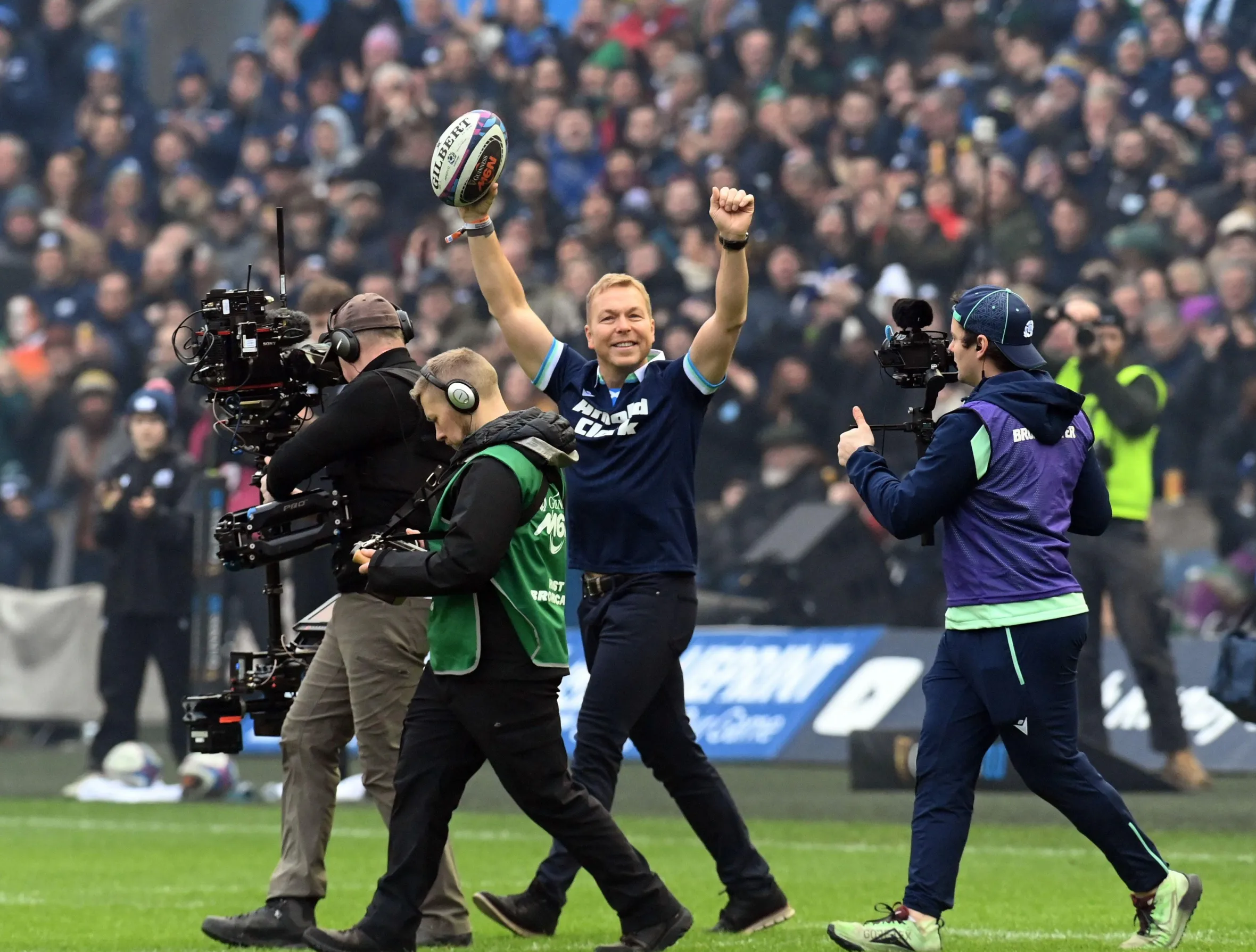 Sir Chris Hoy delivers the match ball at Murrayfield.