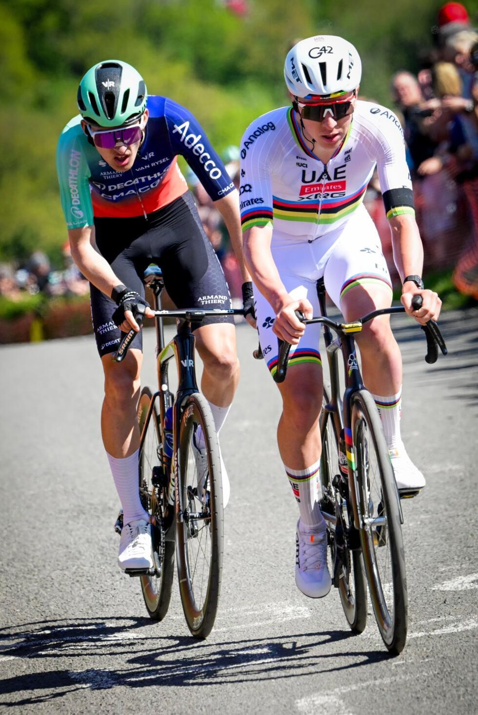 Paul Seixas (L) was the only rider able to stay with Tadej Pogacar (R) when he launched hs customary attack on the Cote de la Redoute
