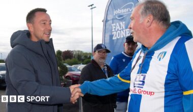 John Terry shakes the hand of a Colchester fan