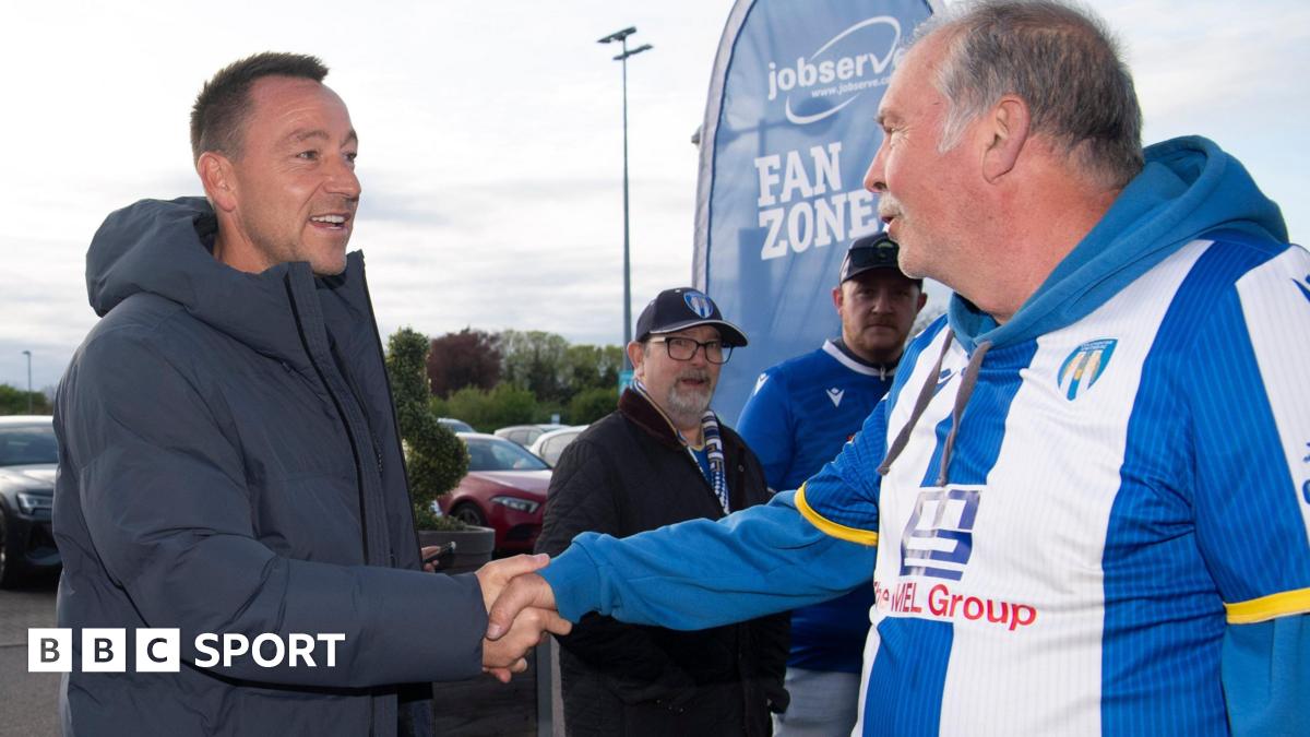 John Terry shakes the hand of a Colchester fan
