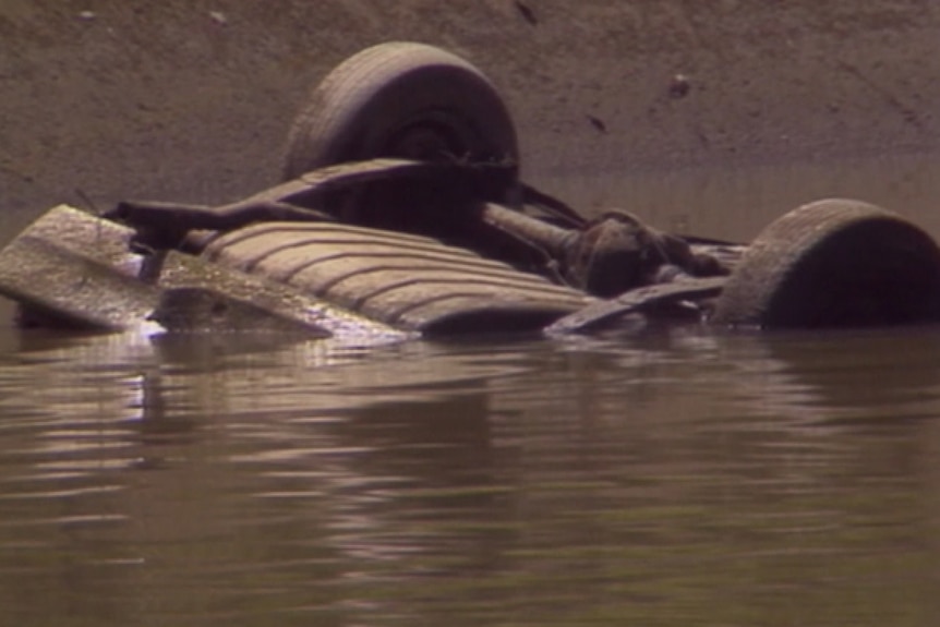A car a Cooks River in 1970s.