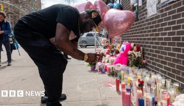 A mourner ties balloons to a memorial and vigil where a 7-month-old baby, Kaori Patterson-Moore, was killed by a stray bullet on April 1 while sitting in her stroller in Brooklyn on April 04, 2026, in New York City.