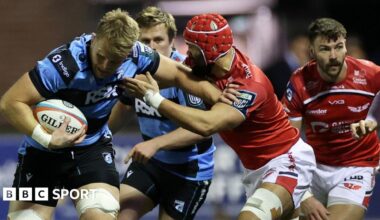 Josh McNally of Cardiff is tackled by Josh Macleod of Scarlets