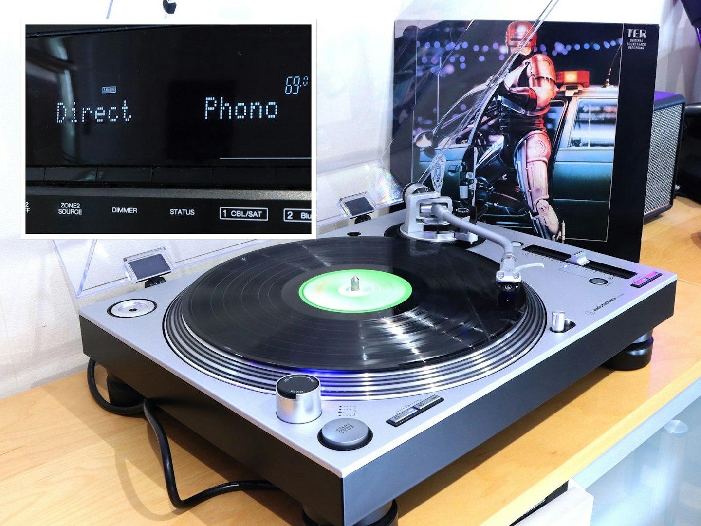 Denon AVR-X2800H Home Cinema Amplifier phono display and a record player with the robocop soundtrack