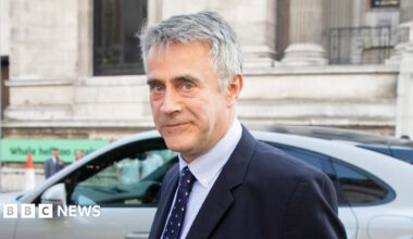 Christopher Harborne arrives at the Victoria and Albert Museum during the Conservative Party Summer Party in 2022. He is a middle aged man with short grey hair in a suit and tie