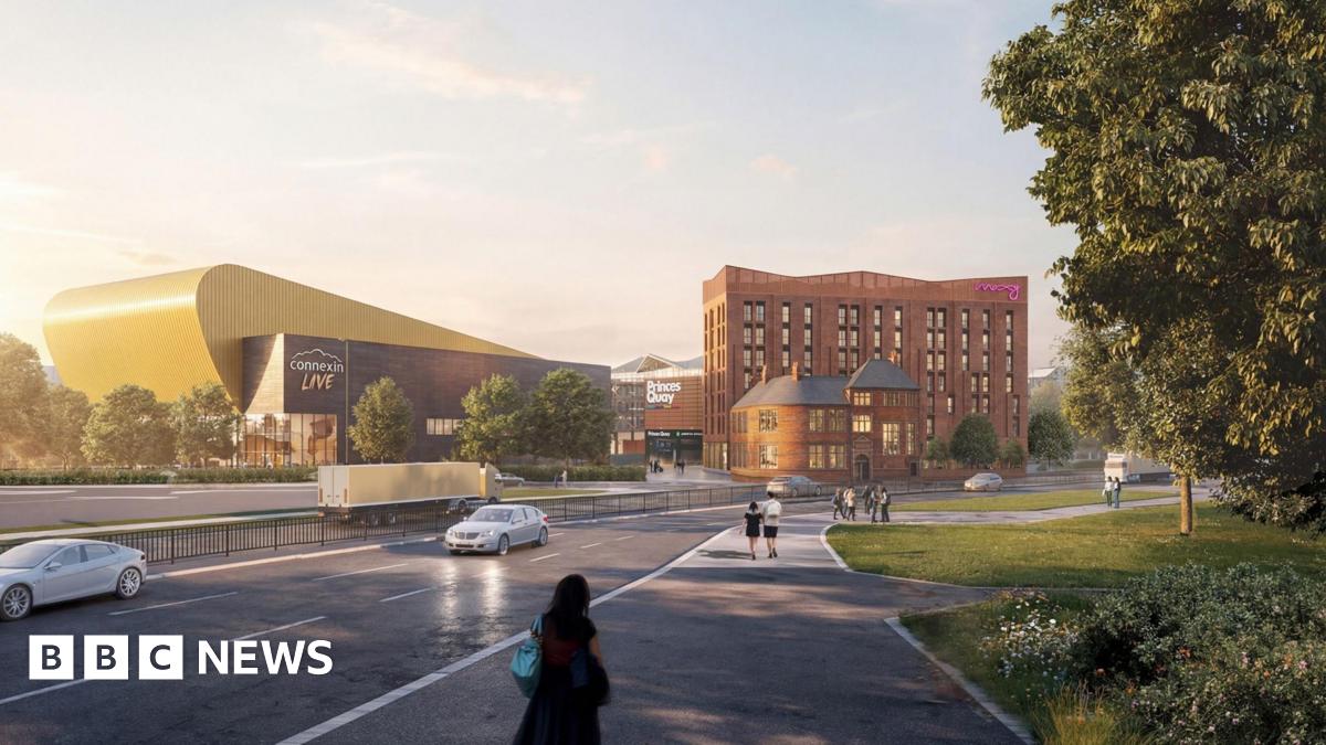 A computer-generated artist's impression of a hotel. A dual carriageway has a steady stream of cars on it while people walk along a path next to it. Across the road is a brown seven-storey building which says "Moxy" in pink lettering. Next to it is a stadium with a yellow building behind it with lettering that reads "Connexin Live".