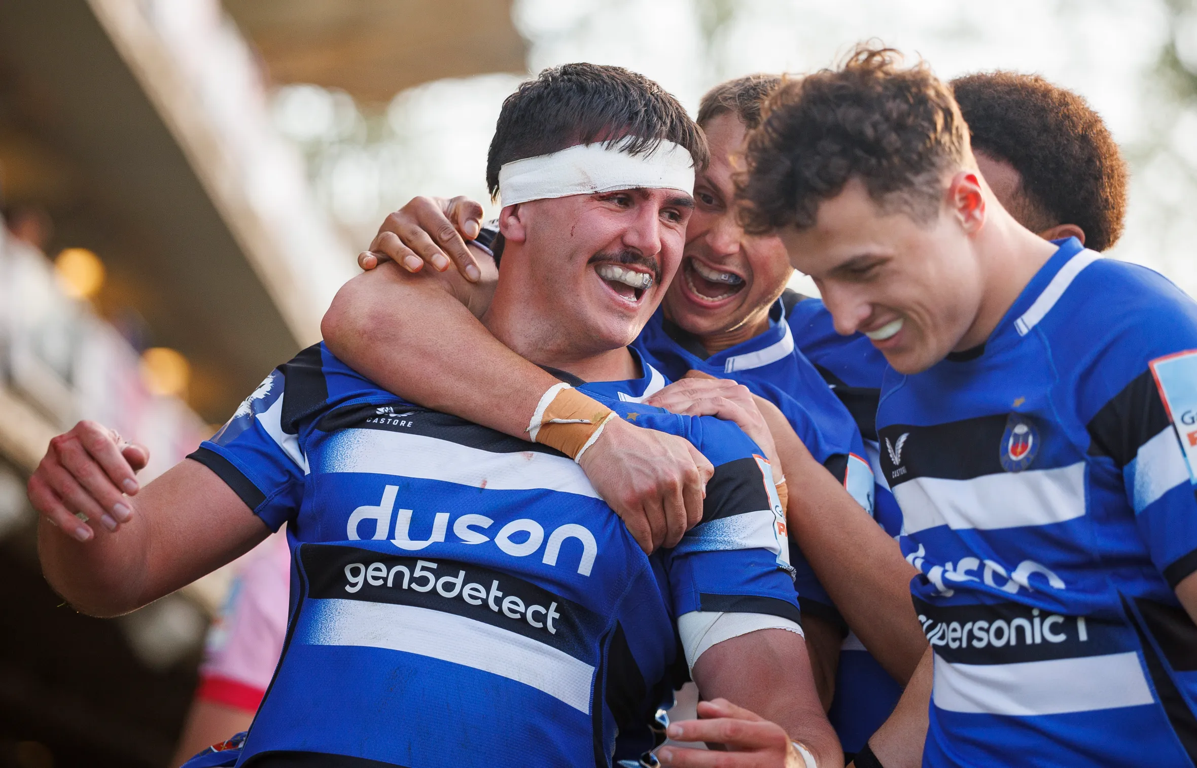 Bath Rugby's Ewan Richards celebrates with teammates after scoring his side's fifth try.