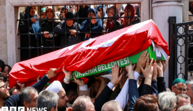 People carry the coffin of a victim of a school shooting during the funeral prayers at a mosque in Kahramanmaras, Turkey
