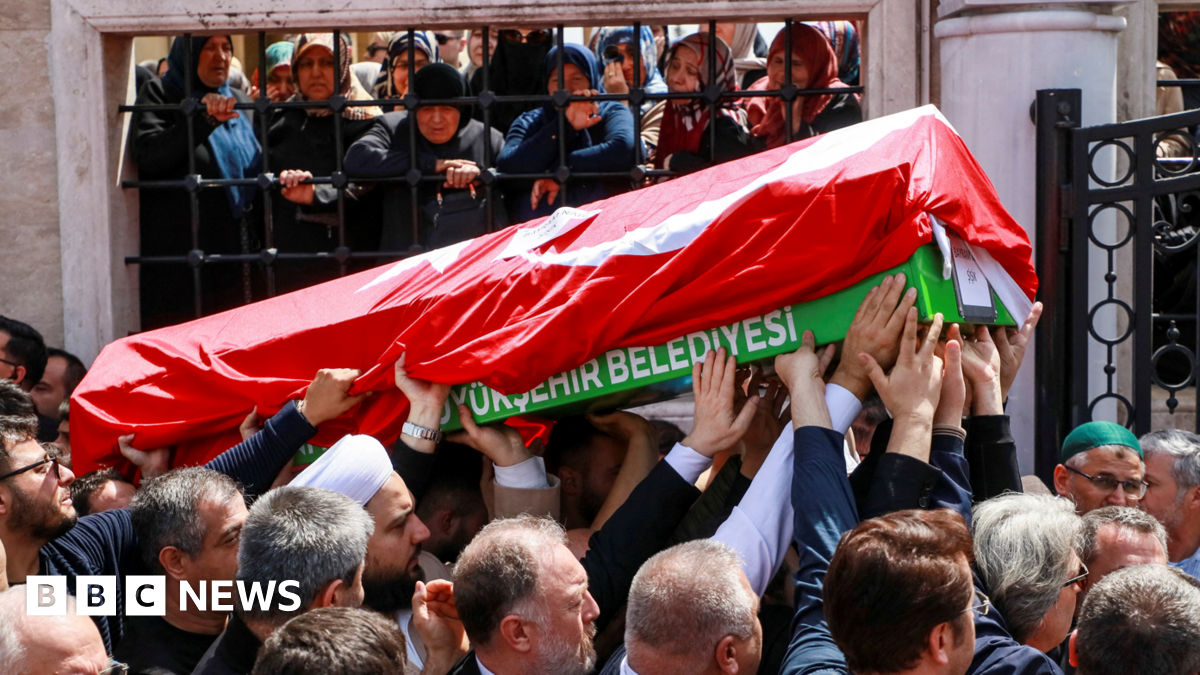 People carry the coffin of a victim of a school shooting during the funeral prayers at a mosque in Kahramanmaras, Turkey