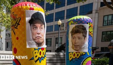 Punching bags with the faces of Musk and Altman seen outside of court
