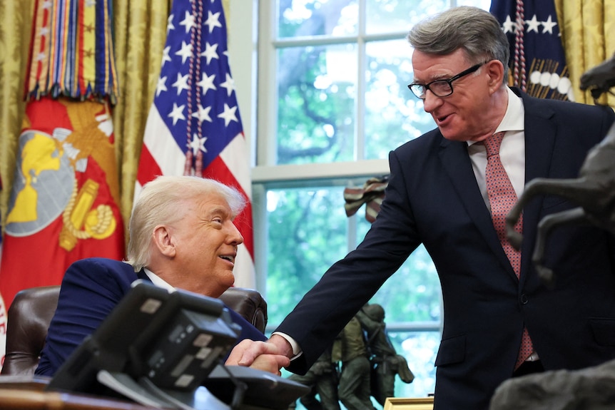 Donald Trump and Peter Mandelson shaking hands in the Oval Office.