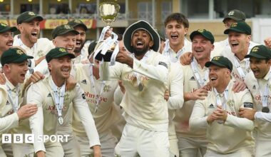 Haseeb Hameed lifts the County Championship trophy at Trent Bridge