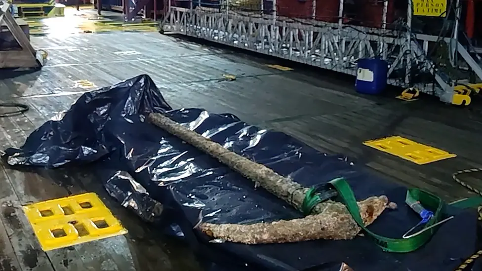 A Roman Era Anchor Lies On Deck After Its Discovery In The North Sea