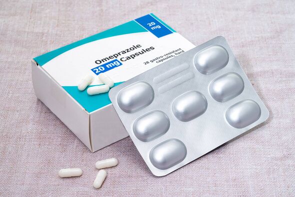 A box and blister pack of generic Omeprazole pills