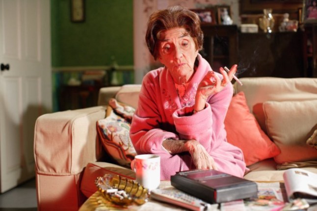 Dot Cotton sat on her sofa smoking a cigarette in EastEnders