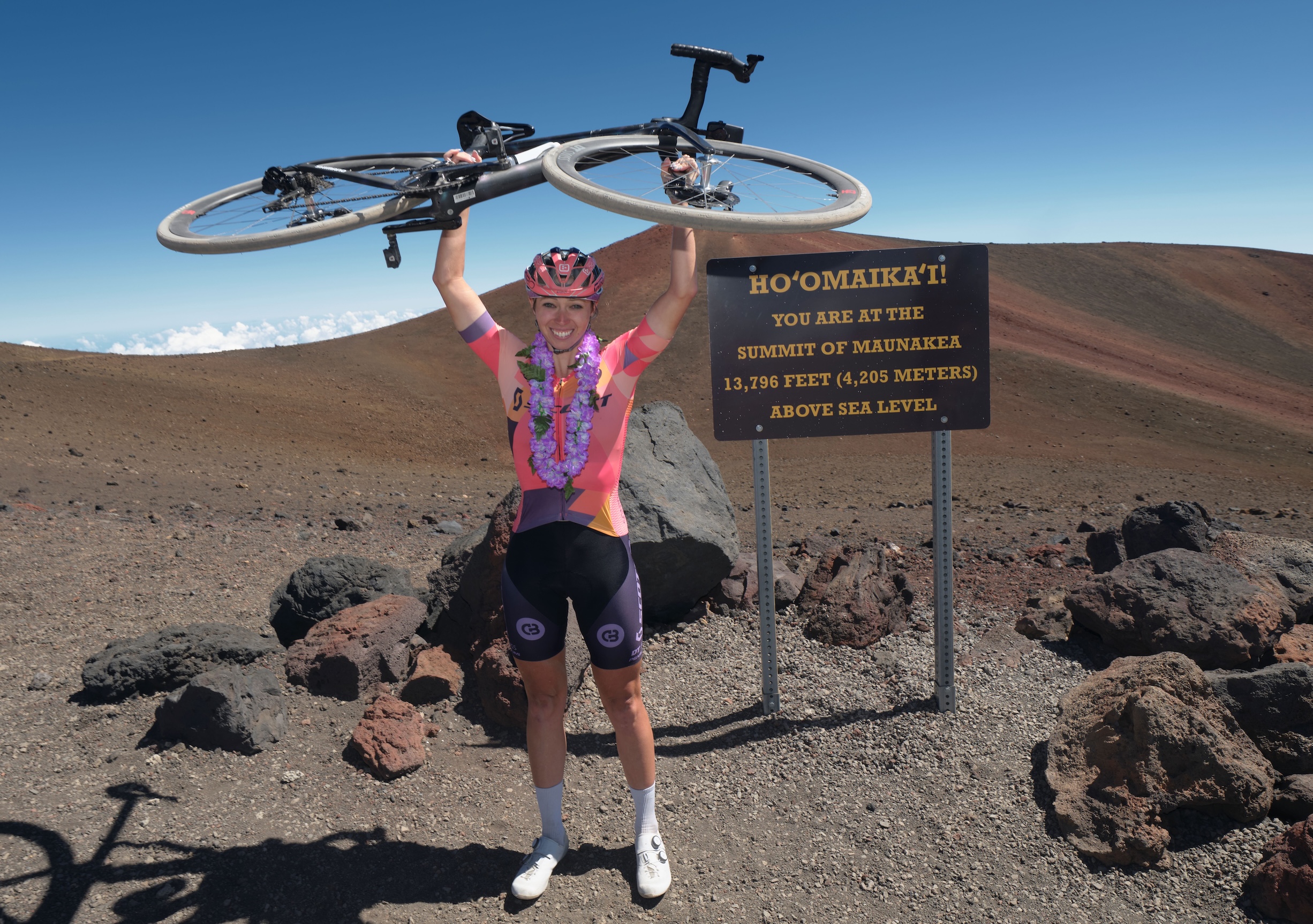 Hannah Otto celebrates setting FKT in October 2025 for riding to top of Mauna Kea in Hawaii