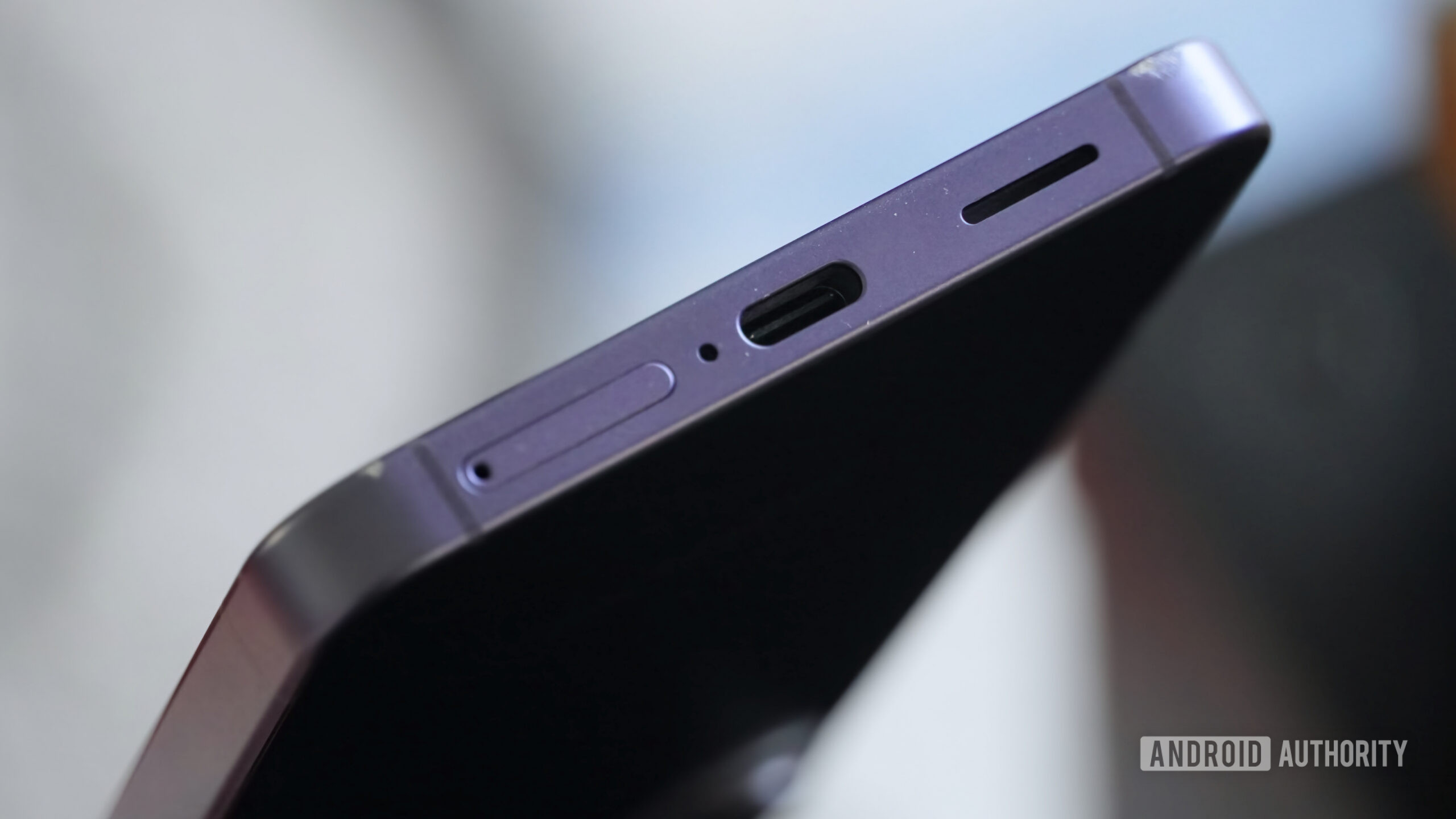 Scratches along the bottom of a purple Galaxy S26.