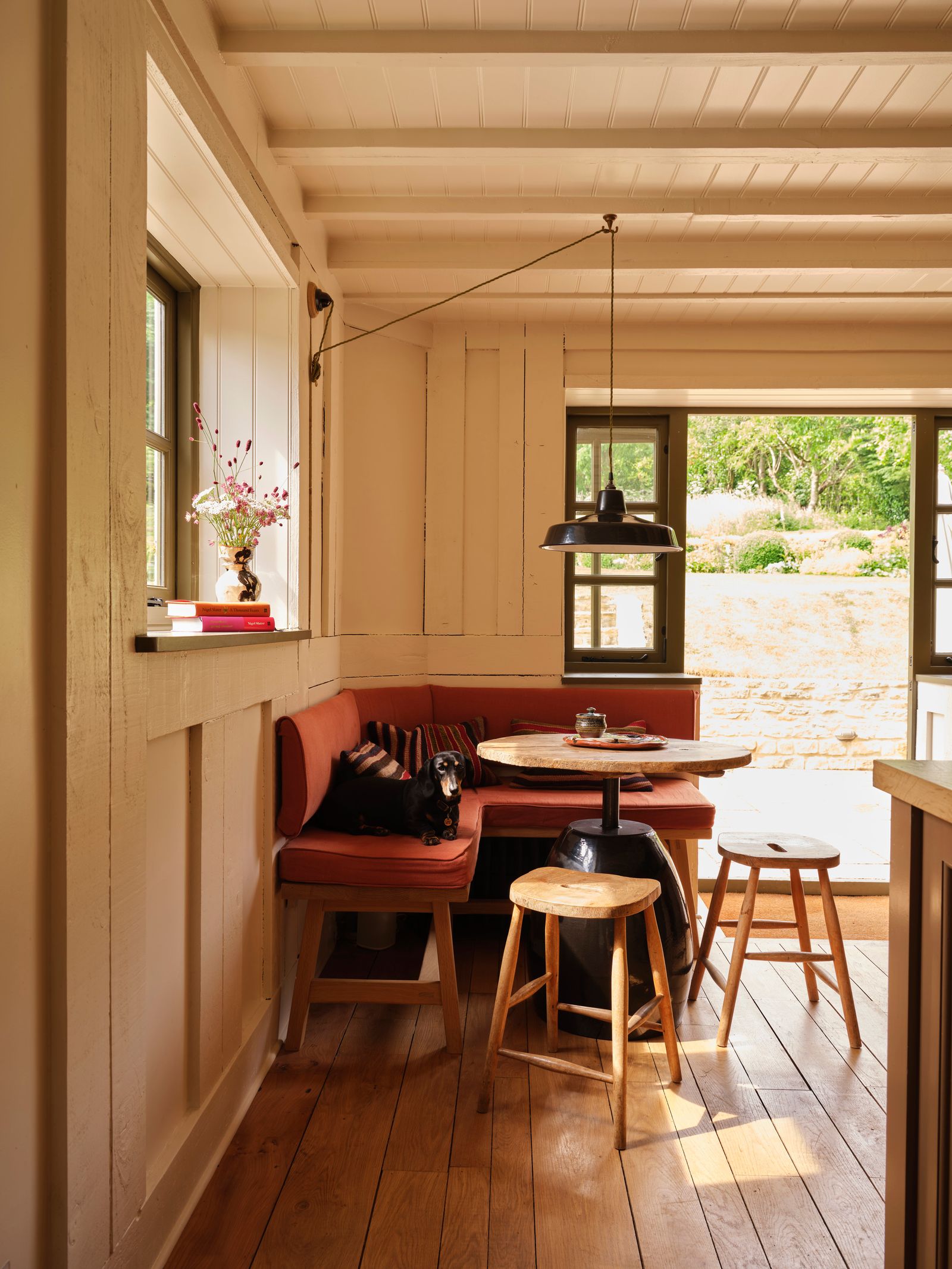 Image may contain Indoors Interior Design Wood Dining Table Furniture Table Architecture Building and Dining Room