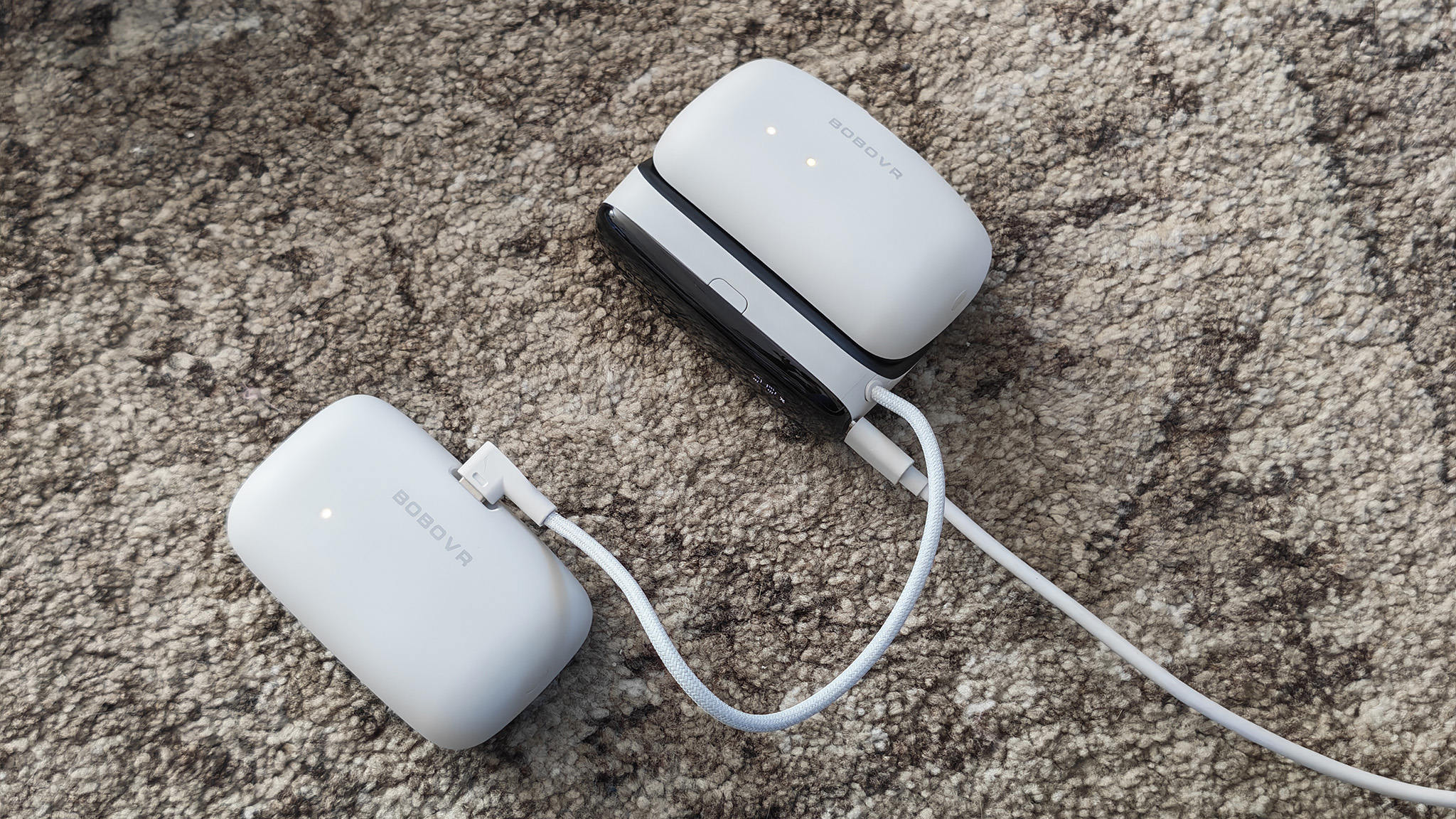 The BoboVR S3 Pro battery dock charging a battery pack