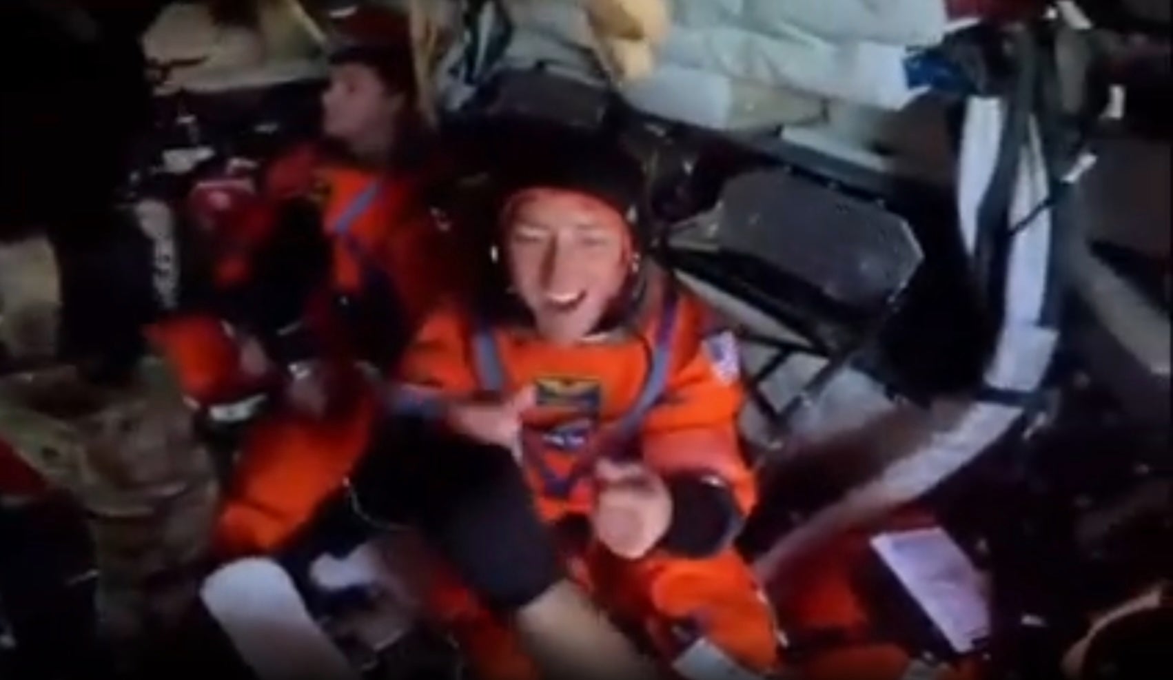 Christina Koch, a NASA mission specialist, double fist dumps U.S. Navy divers on Friday before the Artemis II crew is extracted from the Orion capsule