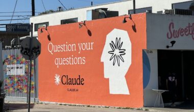 Claude ad on side of building