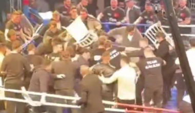 Crowd storm the ring to attack boxer as over 40 people throw chairs and punches in mass brawl
