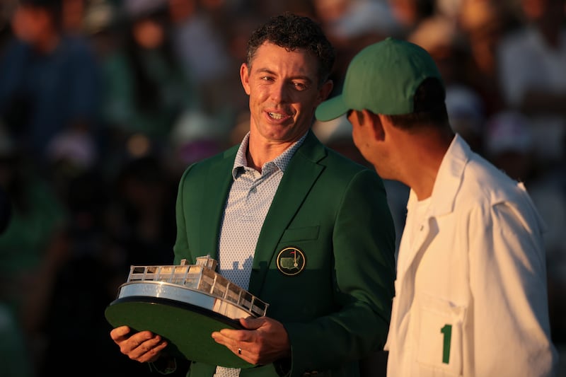 Rory McIlroy celebrates with his caddie Harry Diamond during the Green Jacket Ceremony at Augusta National Golf Club. Photograph: Jared C Tilton/Getty Images