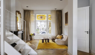 In east Amsterdam, a cool 20th-century townhouse is reworked with a wall of glass