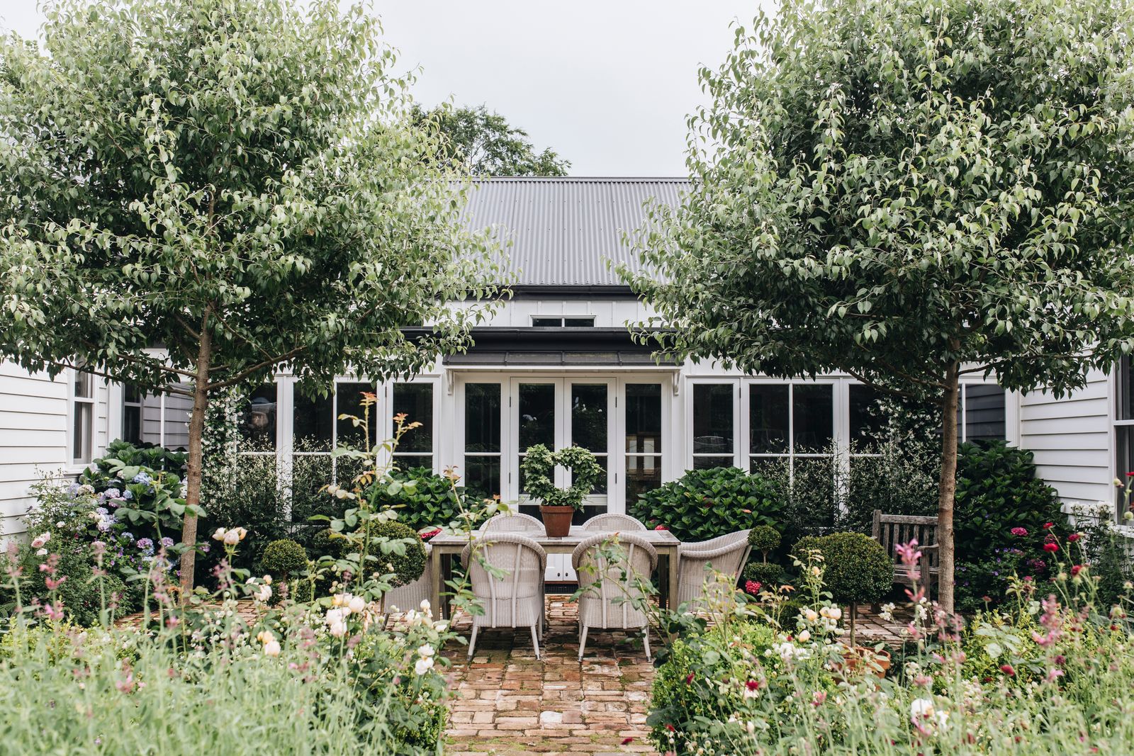 Image may contain Indoors Interior Design Plant Nature Outdoors Yard French Window Window Chair and Furniture