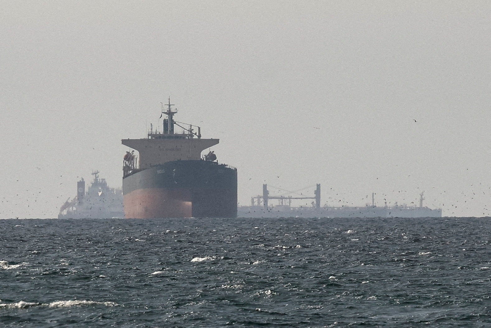 Cargo ships in the Gulf, near the Strait of Hormuz. An oil tanker was fired upon by an IRGC vessel early Sunday in the Strait of Hormuz.