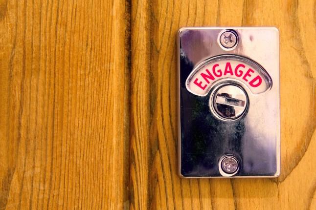 Toilet engaged door sign