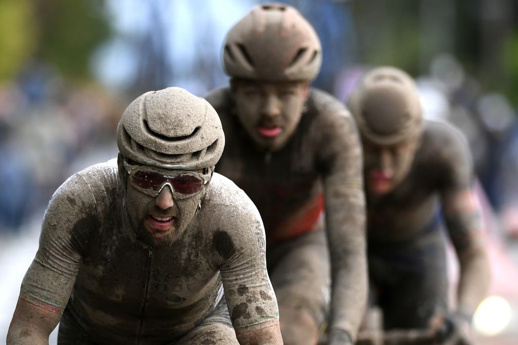 ROUBAIX, FRANCE - OCTOBER 03: Sonny Colbrelli of Italy and Team Bahrain Victorious covered in mud competes in the breakaway during the 118th Paris-Roubaix 2021 - Men