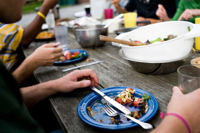 Remnants of a family dinner enjoyed at a rustic table