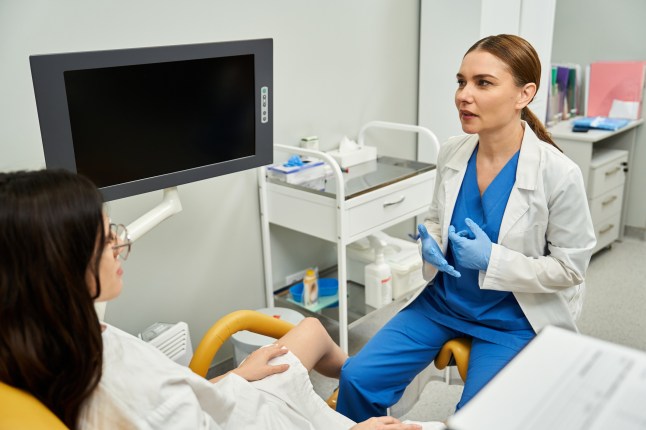 Gynecologist providing professional care to a patient in a modern clinic setting