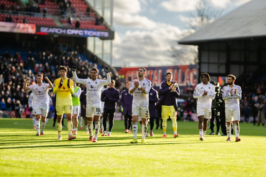 Bruno Fernandes, Patrick Dorgu, Matthijs de Ligt, Noussair Mazraoui, Senne Lammens, Casemiro and Diogo Dalot applaud the fans after the Premier League match between Crystal Palace and Manchester United at Selhurst Park in 2025 in London, England.