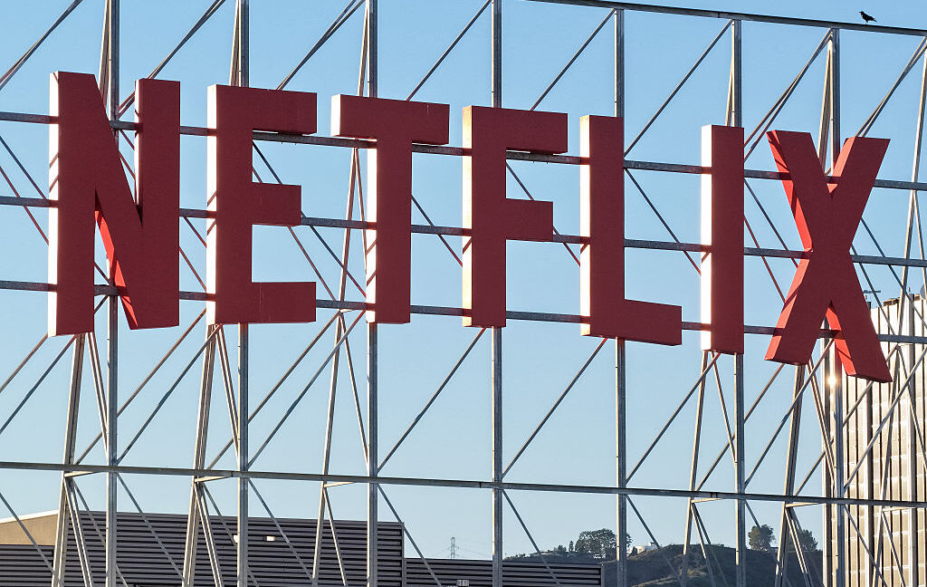 In an aerial view, the Netflix logo is displayed above Netflix corporate offices.