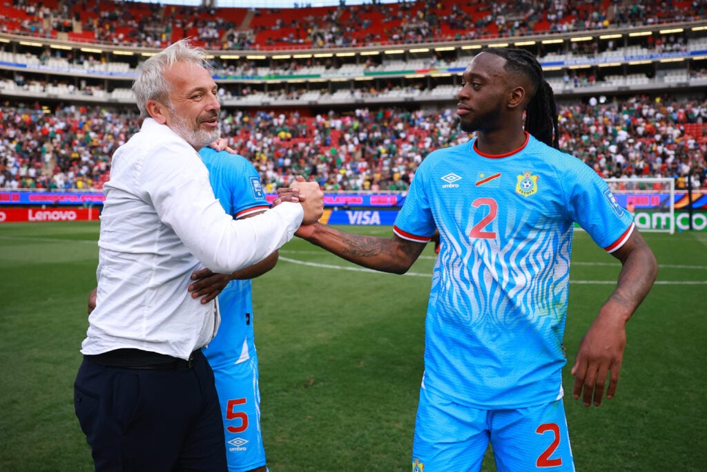 Sebastien Desabre, Head Coach of Congo DR, and Aaron Wan-Bissaka celebrate after winning and qualifying to the FIFA World Cup 2026 Play-Off tournament final match between Congo DR and Jamaica