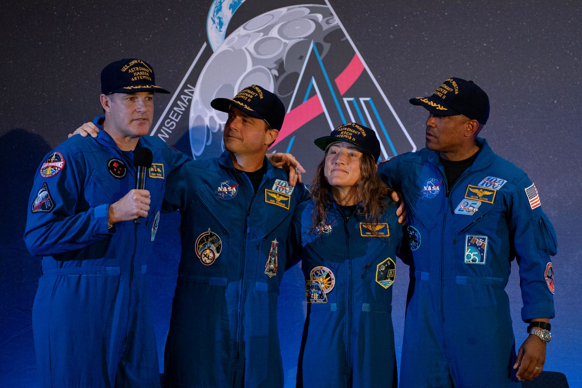 Artemis II astronaut Jeremy Hansen, left, speaks at a news conference with fellow crew members (left to right) Reid Wiseman, Christina Koch and Victor Glover on Saturday at Ellington Field Joint Reserve Base in Houston, Texas. The astronauts will field questions about their mission again on Thursday