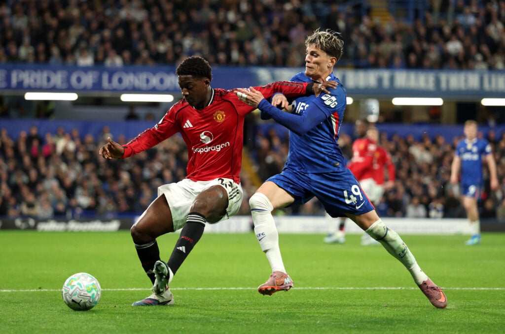 Kobbie Mainoo is challenged by Alejandro Garnacho during the Premier League match between Chelsea and Manchester United at Stamford Bridge in 2026 in London, England.