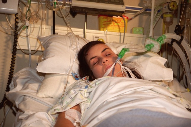 Tiffany Mitchell in a hospital bed with a ventilator