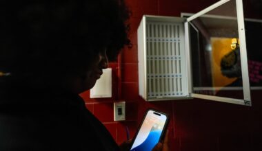A student viewed her cell phone at Ronald McNair Sr. High School, in August in Atlanta.