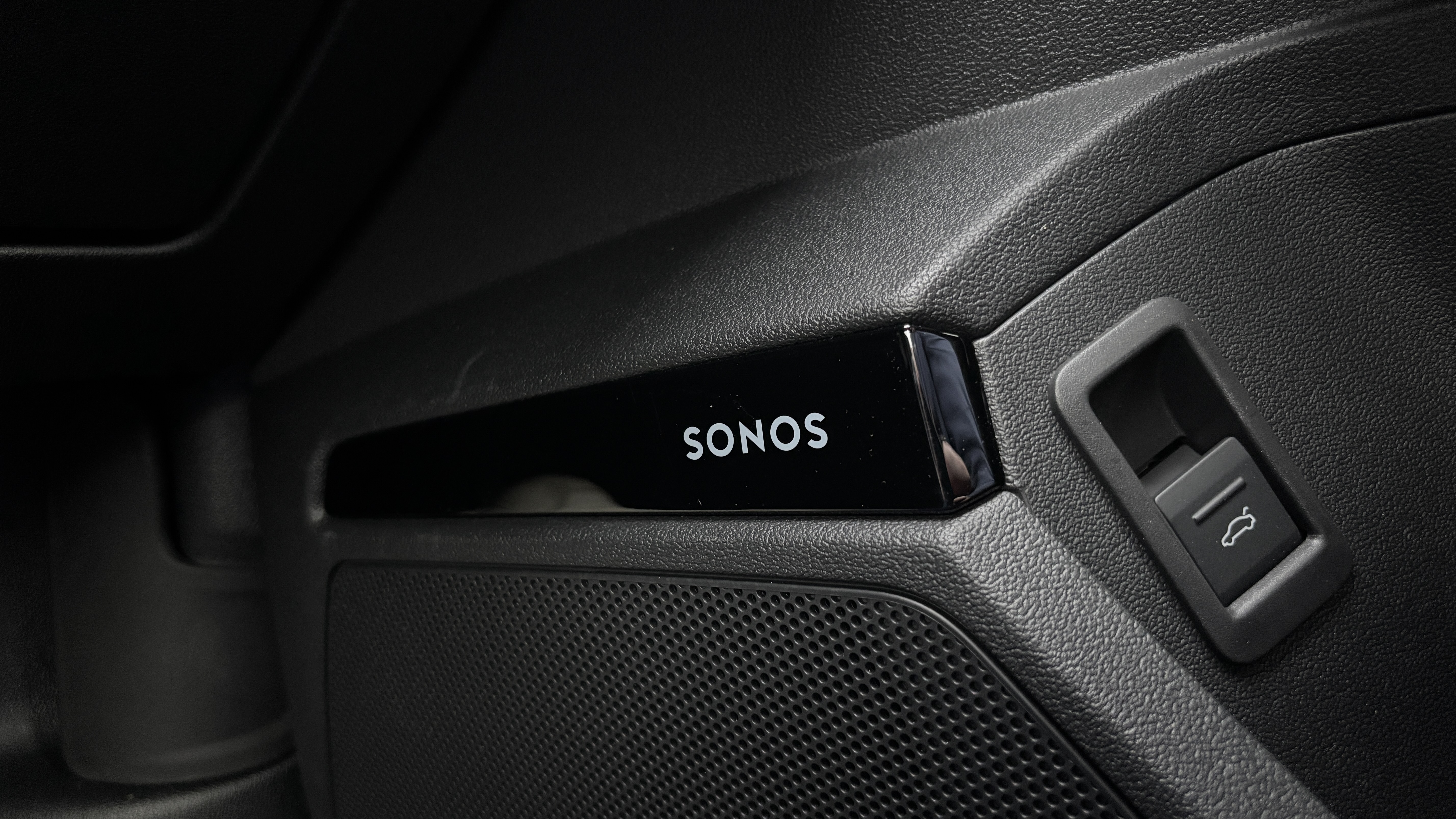 Close-up picture of the Sonos logo on the door of an Audi A3