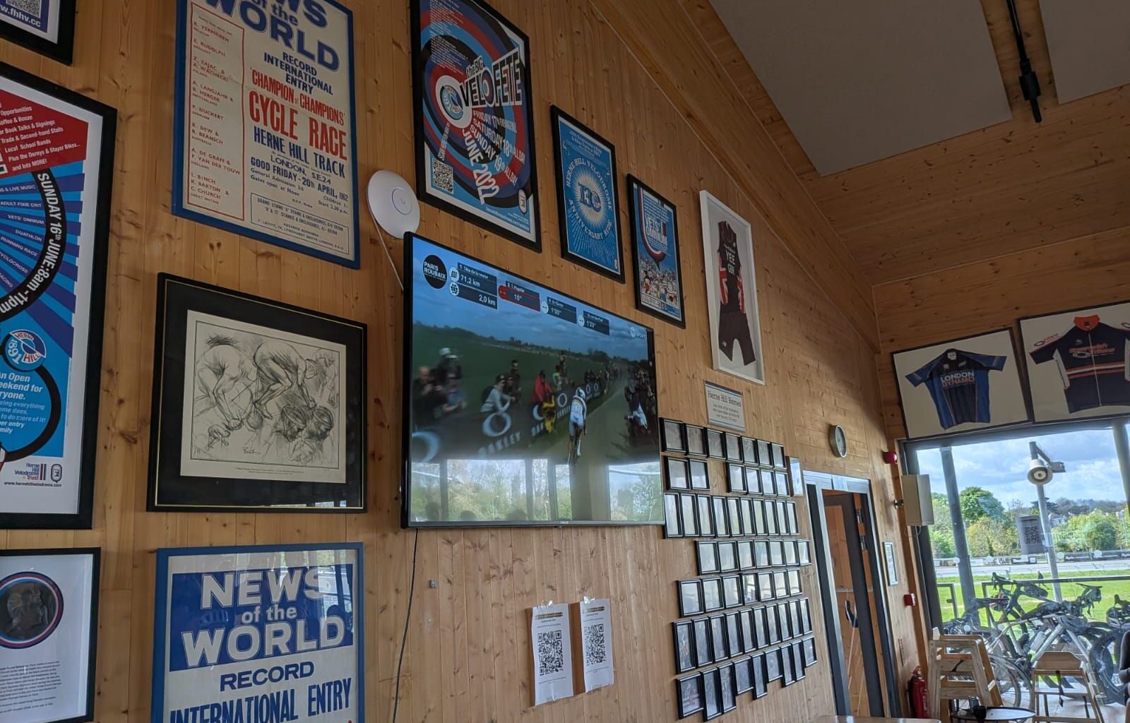 Wall with photos and a tv