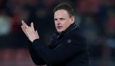 Leyton Orient boss Richie Wellens applauds the fans