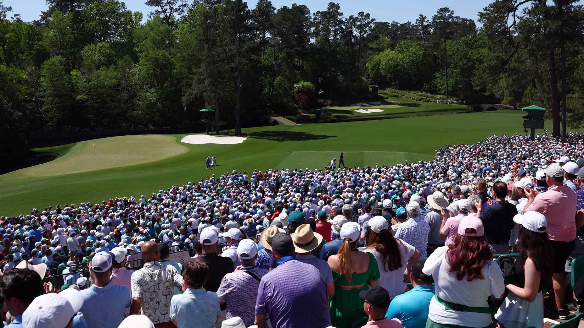 Patrons look on as Tiger Woods of the United States walks to the 12th tee during the final round of the 2024 Masters Tournament at Augusta National Golf Club on April 14, 2024 in Augusta, Georgia.
