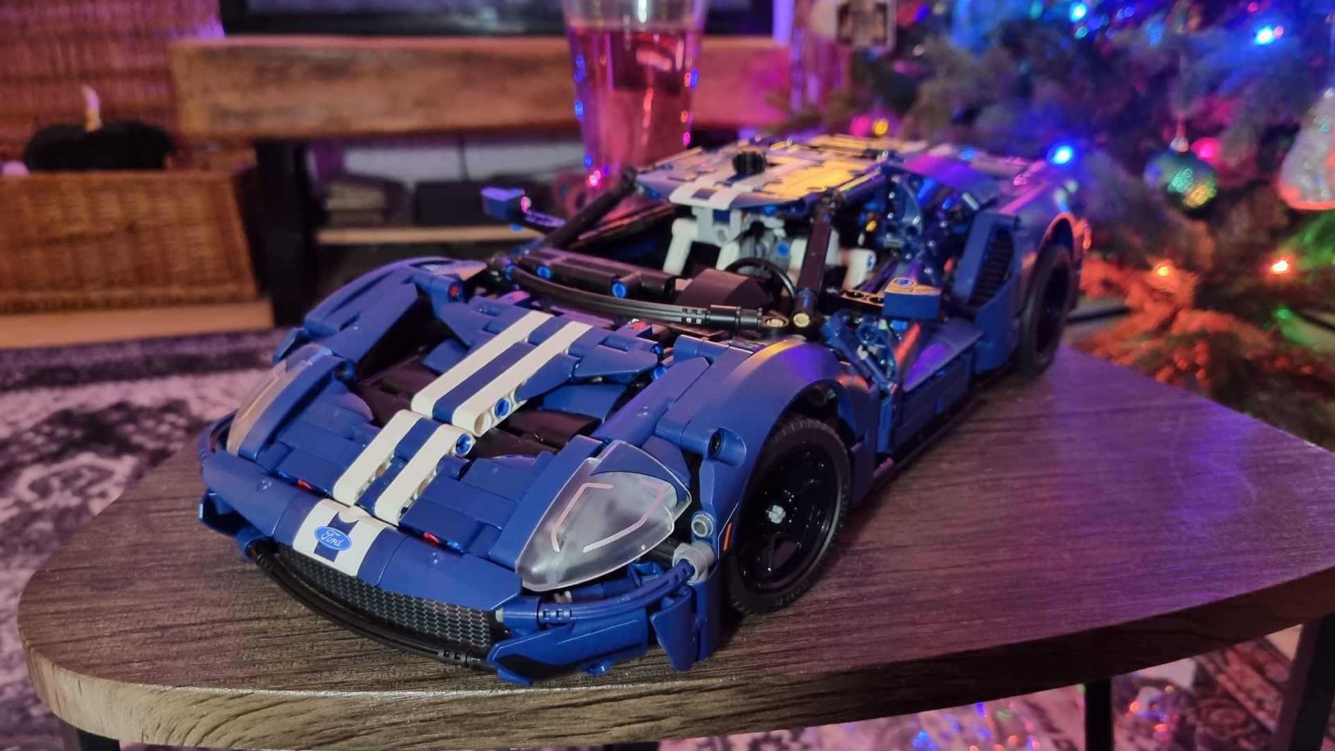 A Lego Technic Ford GT40 2022 model car, in front of a, err, "holiday tree"