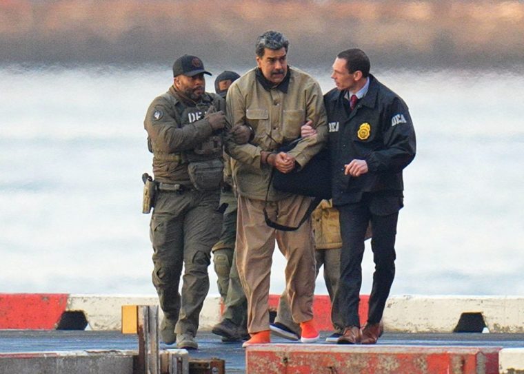 NEW YORK, NY - JANUARY 5: Nicolas Maduro is seen in handcuffs after landing at a Manhattan helipad, escorted by heavily armed Federal agents as they make their way into an armored car en route to a Federal courthouse in Manhattan on January 5, 2026 in New York City. (Photo by XNY/Star Max/GC Images)
