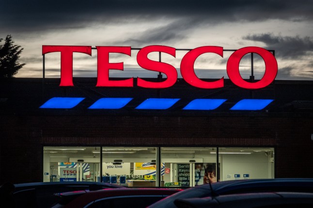 The Tesco logo is displayed outside a branch of the supermarket retailer Tesco on January 19, 2026 in Keynsham, England. (Photo by Anna Barclay/Getty Images)