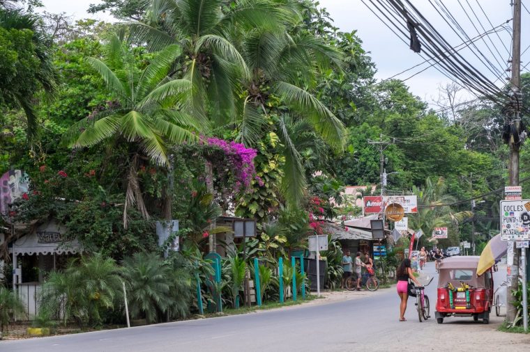 Limon, Costa Rica - September 13, 2022: Scene with lush nature in the streets and highways of Puerto Viejo de Talamanca